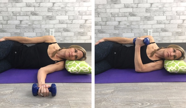 stretching shoulder on floor