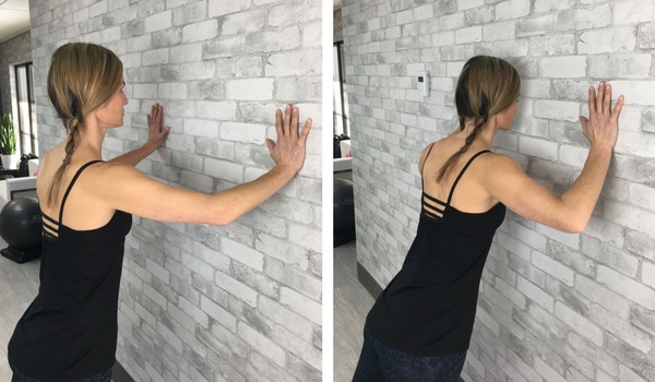 Woman performing wall push up