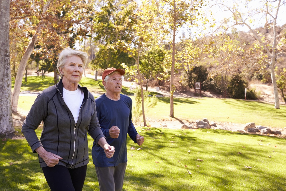 older couple power walking