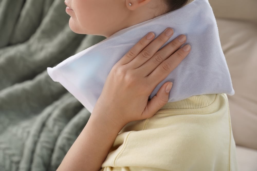 woman with heat pack